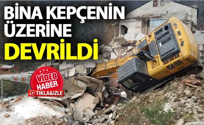 Trabzon'da bina kepçenin üzerine devrildi