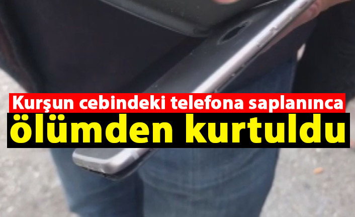 Kurşun cebindeki telefona saplanınca ölümden kurtuldu