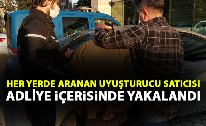 Her yerde aranan uyuşturucu kaçakçısı adliyede yakalandı