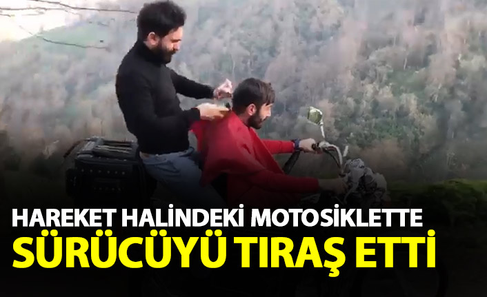 Hareket halindeki motosiklette sürücüyü tıraş etti