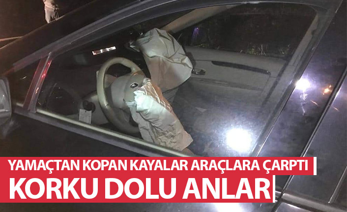 Yamaçtan kopan kayalar araçlara çarptı! Korku dolu anlar