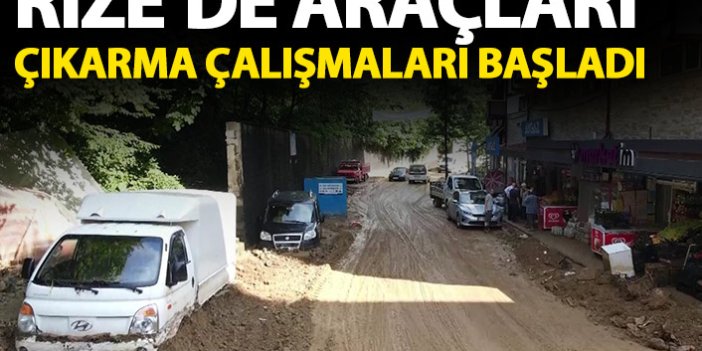 Rize'de moloz yığınların altında kalan araçlar çıkartılıyor